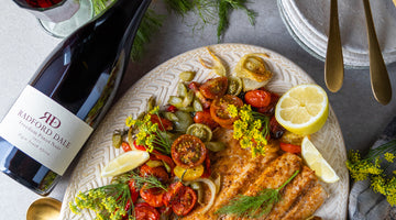 Baked spiced yellowtail with roasted fennel, tomatoes and red pepper